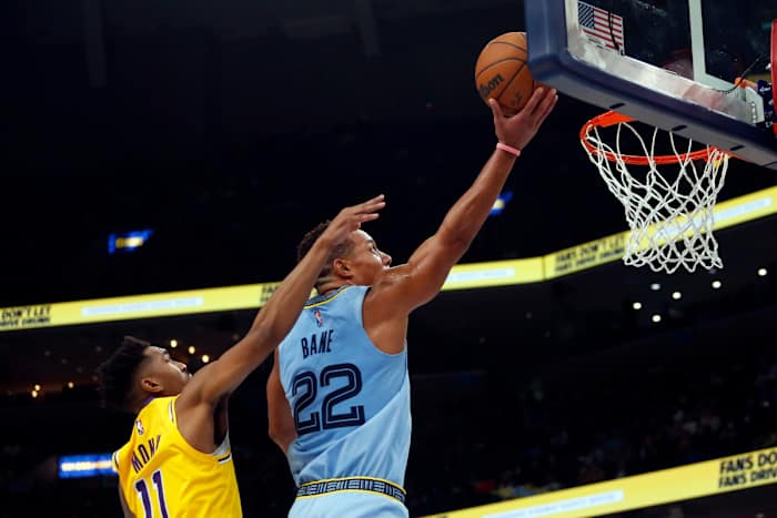 Memphis Grizzles guard Desmond Bane (22) drives to the basket as Los Angeles Lakers guard Malik Monk (11) defends during the second half at FedExForum.